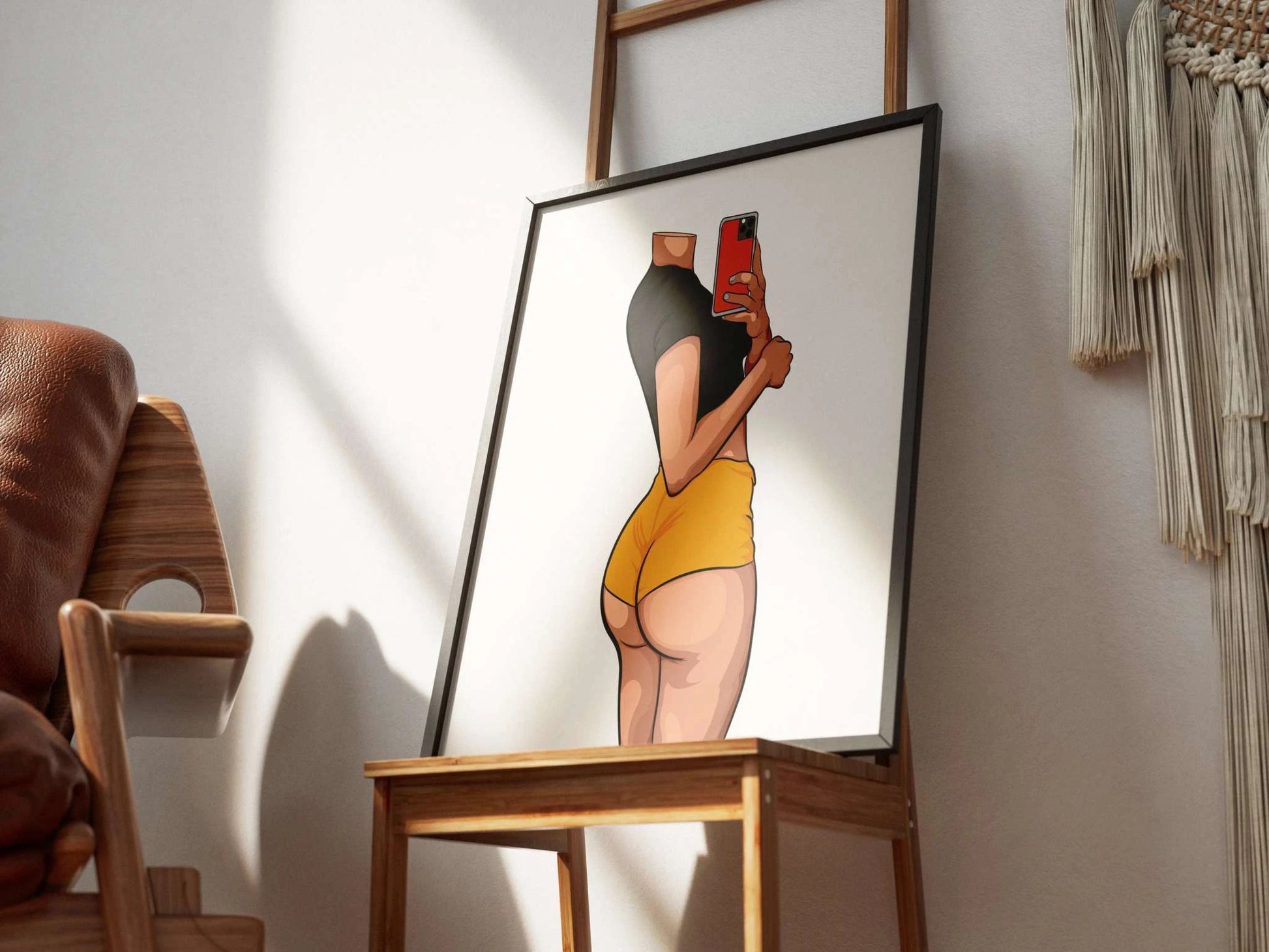 Model 42 - Baked Art digital artwork in a frame on a wooden chair, featuring vibrant colors and bold lines.