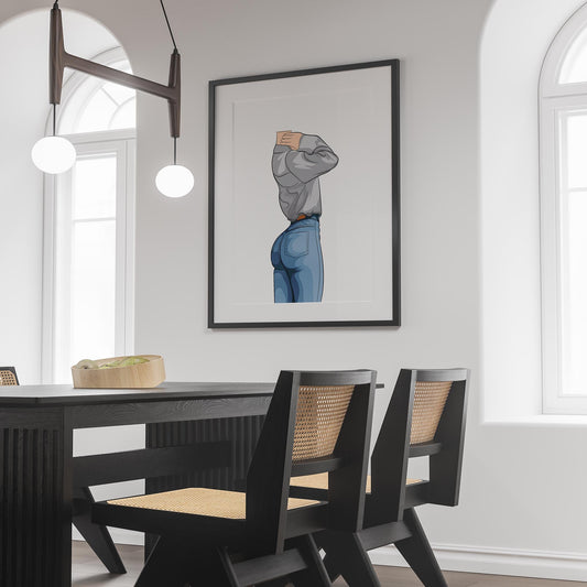 Framed art print of character in denim jeans and sweatshirt on wall above dining table.