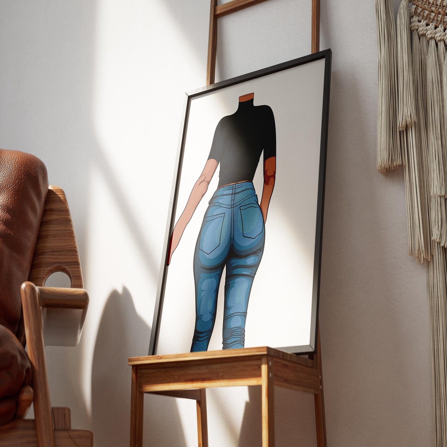 Framed pop art of figure in high-waisted jeans on wooden easel in cozy room.