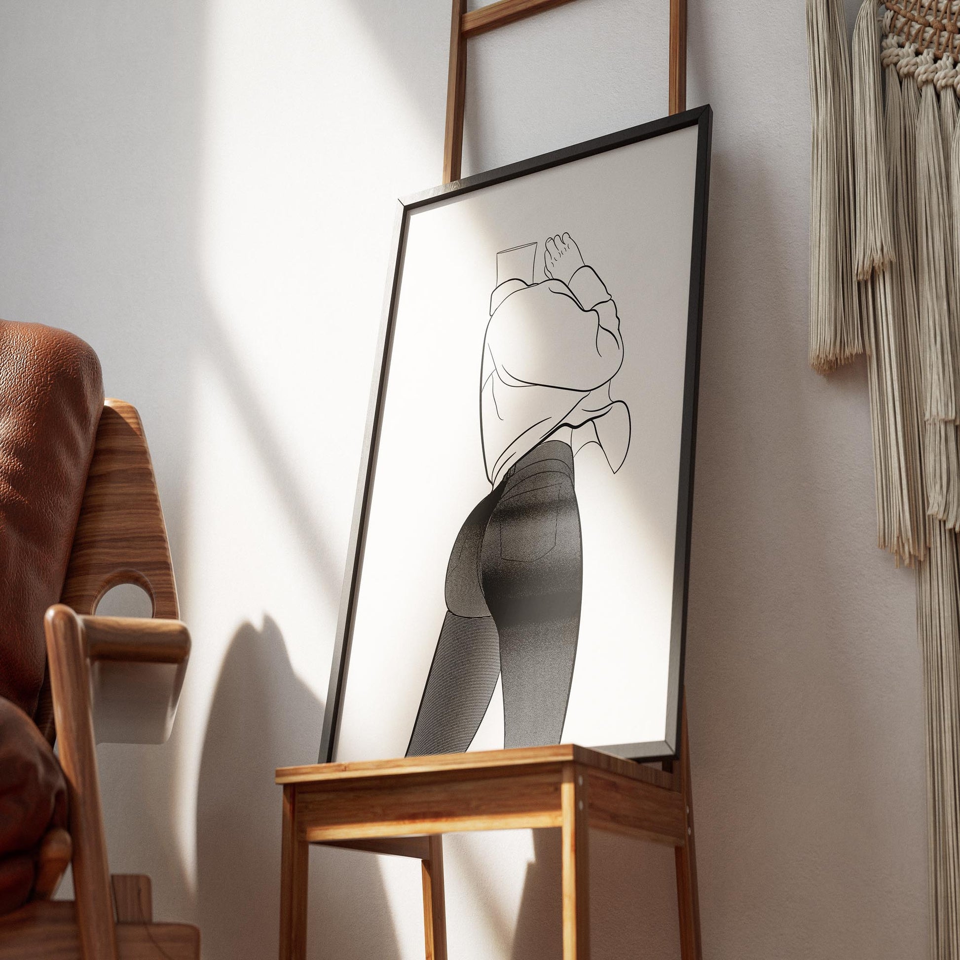 Line art illustration of fitted high-waist denim and sleeveless top displayed on a wooden easel.