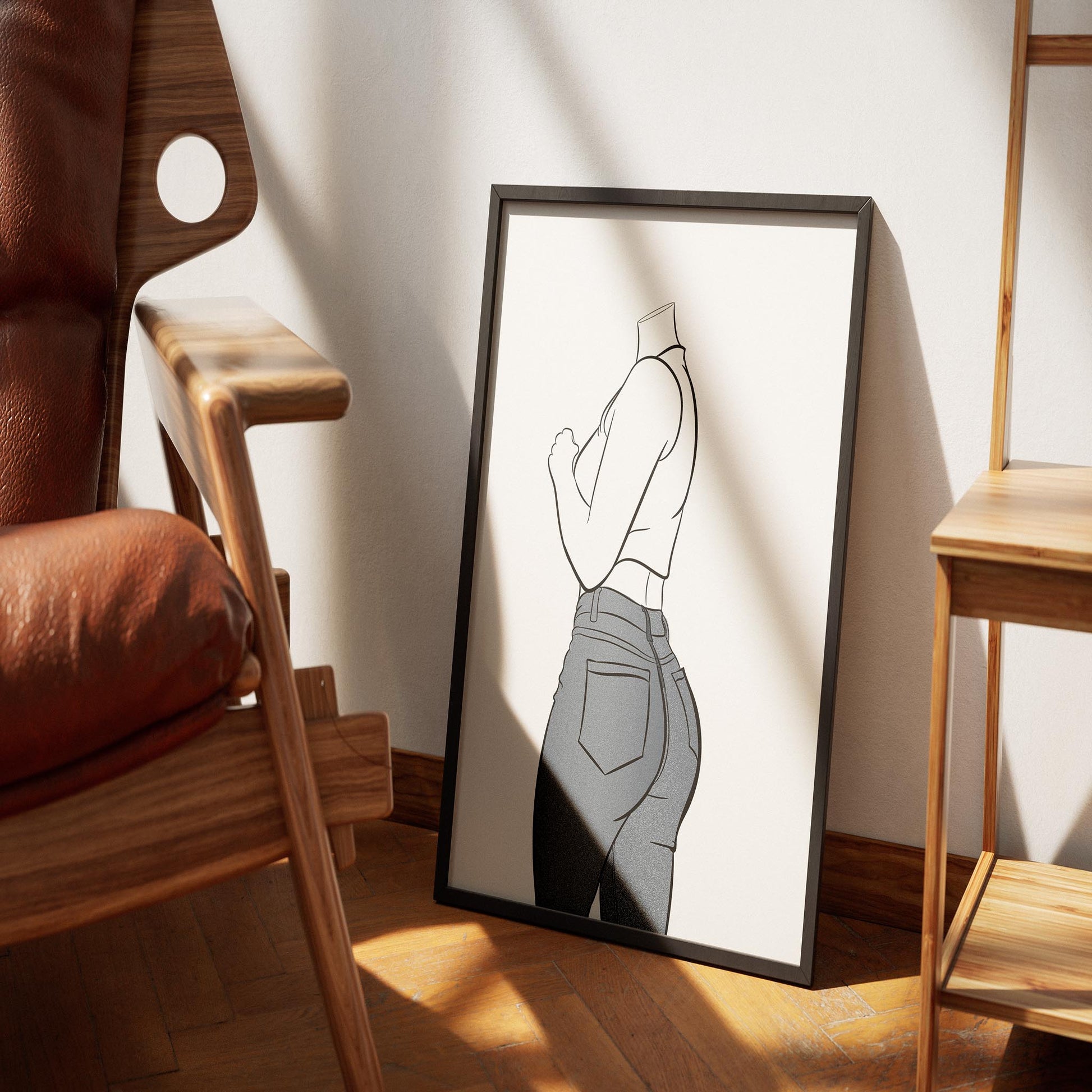 Line art illustration of a figure wearing blue denim jeans and a sleeveless top, framed and displayed on wooden floor.
