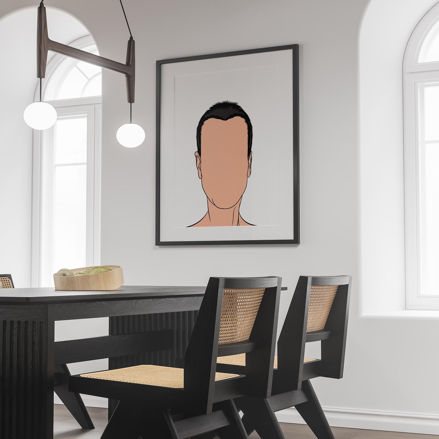 Minimalist art print depicting faceless character on wall of modern dining room.