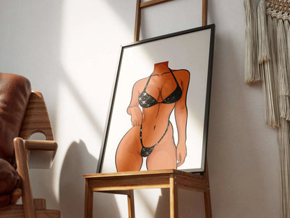 Model 4 - Baked Art digital artwork in a frame on wooden chair, showcasing a stylized bikini-clad figure.