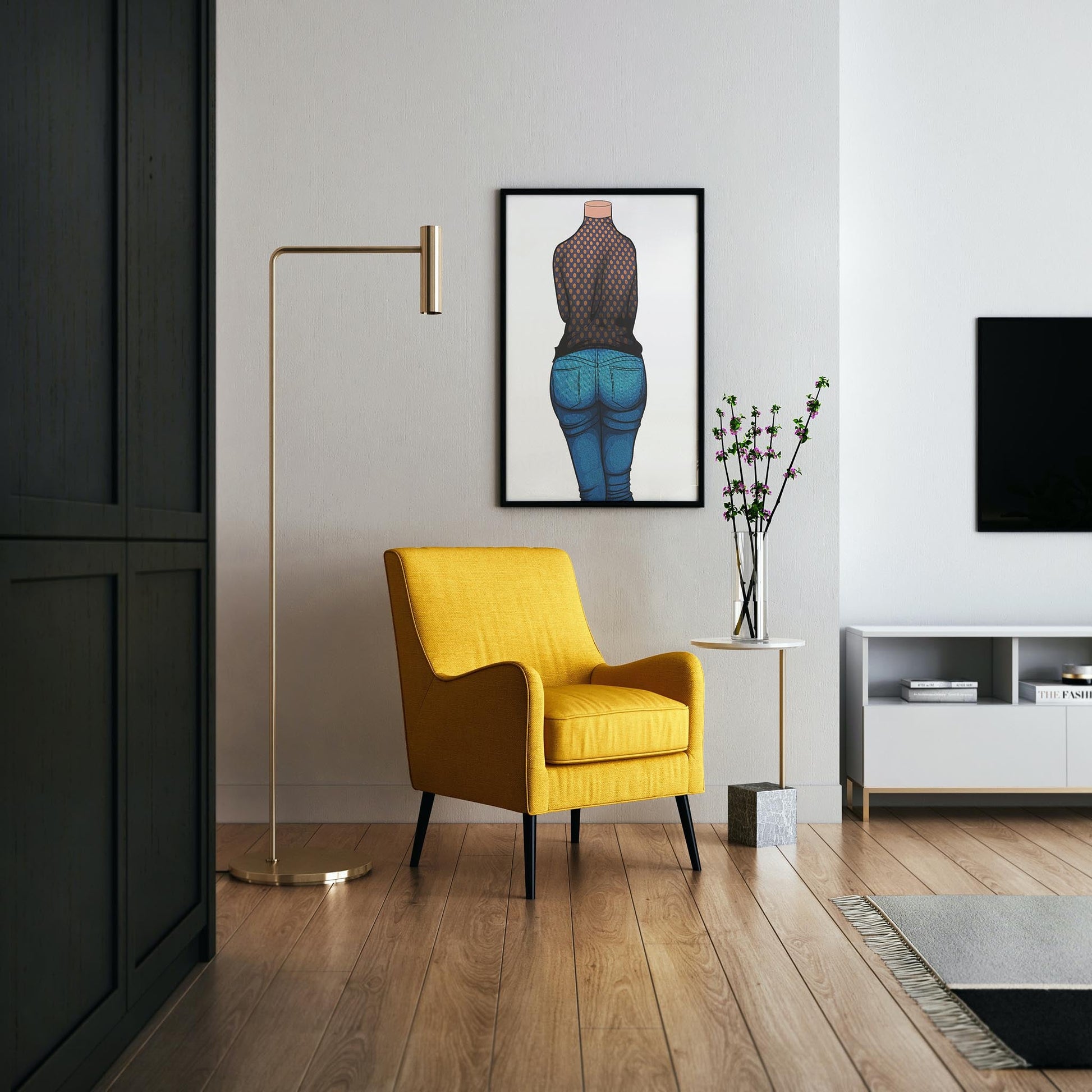 Stylish living room with a yellow chair and a framed digital art print of high-waisted denim jeans featuring polka dots.