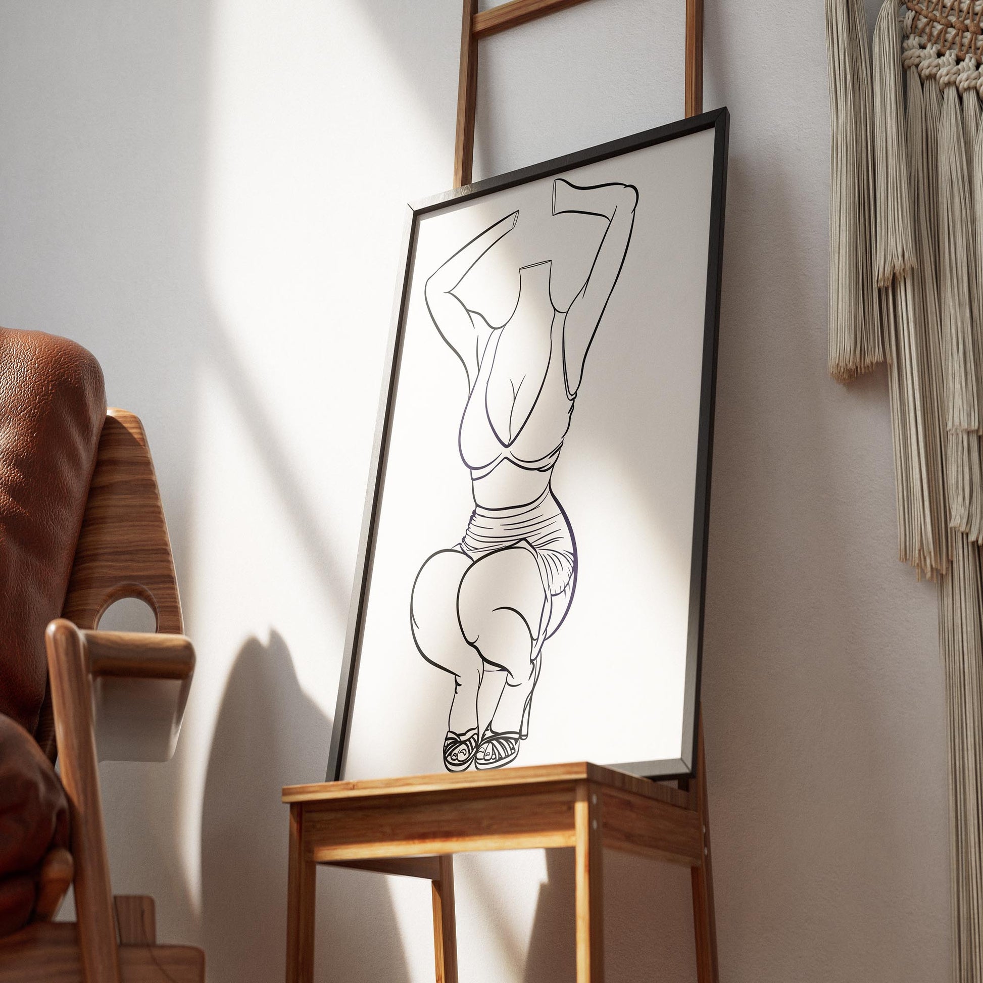 Line art illustration of a contemporary dress in a chic pose, framed, leaning on a wooden table.