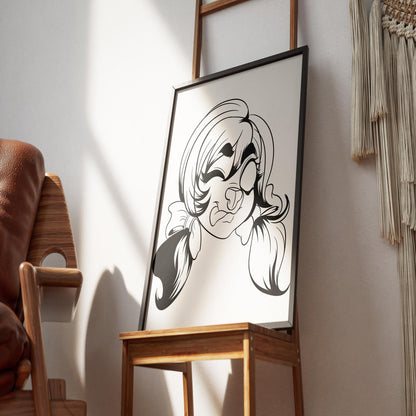 Framed line art illustration of a whimsical furry character with pigtails, displayed on an easel in a cozy room.