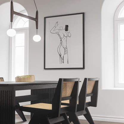 Line art of a flowing gown with plunging neckline, framed and displayed in a modern dining room.